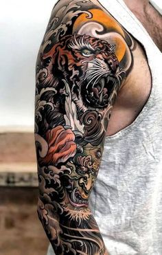 a man with a tiger tattoo on his arm