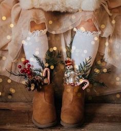 a pair of boots with christmas decorations on them