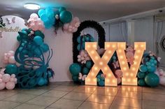 balloons and lights are arranged in the shape of letters