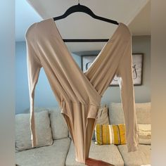 Soft Almost Like Suede Ish. Fits On Body Like A Glove Pink Fitted V-neck Bodysuit, Beige V-neck Jumpsuits And Rompers For Night Out, Pink V-neck Bodysuit For Spring, Pink V-neck Spring Bodysuit, Beige Stretch Bodysuit For Night Out, Stretch Beige Bodysuit For Night Out, Beige V-neck Bodysuit For Spring, Fitted V-neck Bodysuit For Loungewear, Spring Beige V-neck Bodysuit