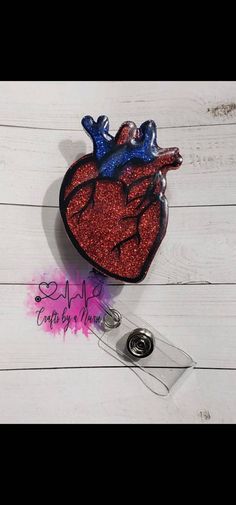 Red and Blue Glittered Heart Badge Reel (Seen as pictured above). Handmade to order. DETAILS: -This badge reel measures approximately 2 inches with the base 1/8-inch-thick acrylic with amazing quality and durability.  The badge reel is easy to clean (especially for healthcare workers!) -Hand glittered and sealed with resin/epoxy for added protection against wear and tear while also giving it a smooth finish. - 24" (belt clip) retractable badge reel -This is a handmade item and is made to order. Heart Badge Reel, Valentines Badge Reel, Cheap Customizable Red Badge Reel, Handmade Novelty Pink Badge Reel, Cheap Multicolor Novelty Badge Reel, Healthcare Workers, Flying Pig, Glitter Hearts, Retractable Badge Reel