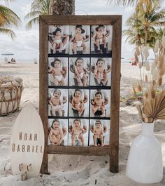 a wooden sign with photos of babys on it next to a surfboard and palm trees