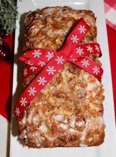 two pieces of granola sitting on top of a white plate next to a christmas tree