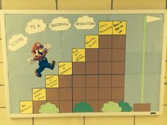 a bulletin board with an image of mario running up the hill and words written on it