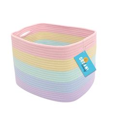 a pink, yellow and blue striped basket with a tag on it