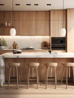 a kitchen with marble counter tops and stools next to an island in the middle