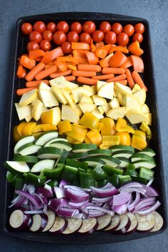 an assortment of vegetables are arranged in a tray