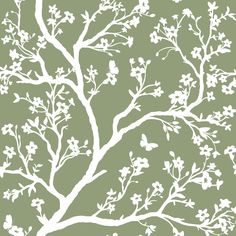 a tree with white branches and flowers on a green background