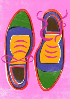 a pair of colorful shoes on a pink background