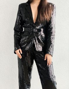 Stand out in this classic sequin blazer at all events!!!Fabric used is sequin and it is lined with a soft lining so it's very comfortable to the skinJacket length is 27cm and trouser length is 45cm Model is 5'9 and is wearing a US Size 4Care instruction - Dryclean or handwash. No need to iron Color - Black The blazer is a boyfriend jacket with shoulder pads and is loosely fitted and the trouser is a high waist pant fitted at the waist and loose from the thighs down 60s Suit, Black Sequin Blazer, Candy Apple Green, Blazer With Shoulder Pads, Summer Day Dresses, Office Suit, Boyfriend Jacket, Elegant Jacket, Womens Suits