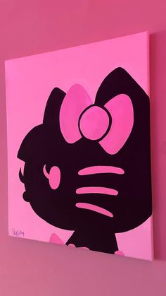 a hello kitty painting on a pink wall