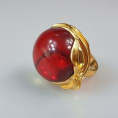 Amber ring. Ruby red Amber ring. Gold plated handmade ring. This ring is adjustable. You can change size by pressing it. Very easy to do. Stunning red ring will be just the best gift for her. Gemstone size 2,6-2,7 cm. Weight 13,79 gr. Big round - circle ring. This item was made of natural Baltic Amber. All the amber used in my jewelry is collected in my home country Lithuania. I sell only genuine, real, Baltic Amber. This is a yellow amber stone processed and paintedto make it look ruby red. Unique Amber Rings For Formal Occasions, Formal Amber Rings, Elegant Handmade Red Rings, Formal Red Dome Ring, Red Cabochon Ring Jewelry, Formal Amber Open Ring Jewelry, Elegant Red Cabochon Ruby Ring, Elegant Handmade Gold Ruby Ring, Elegant Red Dome Ring For Anniversary