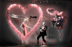 mannequins dressed in pink and black with heart shaped decorations