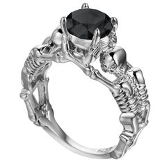 This ring is one of our popular skull rings for her! This beautifully crafted masterpiece ring features two skeletons holding a 3.0 ct round cut center stone set on prongs. This piece represents ‘together forever’ or ‘until death do us part’. Skull Rings for Her Features: Materials: High quality metal Platinum top layer, Cubic Zirconia stone This skull ring for her is featured in a blog post about skull jewellery fashion. Buy Womens skull rings Are Cheap Engagement Rings OK? Goth Biker, Skeleton Ring, Stile Hip Hop, Artisan Rings, Gothic Rings, Rock Chic, Rings Engagement, Ring Pendant Necklace, Unisex Ring