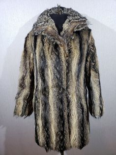 Warm black-brown women's fur coat with genuine fur. Reliable black and brown women's fur coat with genuine fur. The fur coat is made of genuine undyed fur. The fur coat fastens on metal hooks. The fur coat has two convenient pockets at the bottom. The fur coat has a pleasant lining. Wearing a fur coat is pleasant and comfortable. The coat will perfectly emphasize your sophistication and luxury. MEASUREMENTS Length                                              82 cm  |  32.5 in Pit to pit                                            52 cm  |  20.5 in Chest circumference                   104 cm  |  41 in                                                             Waist  circumference                    114 cm  |  45 in                                           Bottom circumference Long Faux Fur Mink Coat, Mink Color Long Fur Coat With Faux Fur Lining, Mink Colored Fur Coat With Faux Fur Trim, Brown Long Coat With Faux Fur Trim, Mink Colored Faux Fur Coat, Mink Coat, Womens Jackets, Fur Coats Women, Cool Jackets