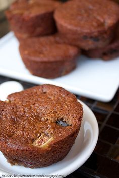 two white plates with muffins on them