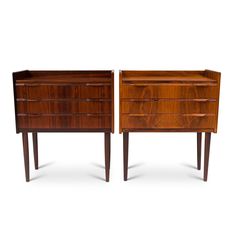 a pair of mid century modern walnut nightstands