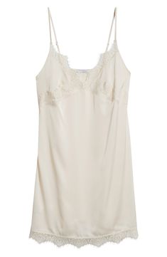 Feel your most glamorous through your morning and nighttime routines in this satin chemise trimmed in delicate lace. 25" center front (size medium) V-neck Adjustable straps 100% polyester Machine wash, dry flat Imported Fitted Lace V-neck Chemise, V-neck Satin Camisole With Lace Trim, Elegant Slip Dress For Loungewear, Elegant Sheer Slip Dress For Daywear, Elegant Cami Chemise For Sleep, Chic Nightgown For Wedding Night, Elegant Summer Sleep Chemise, Lace Trim Cami Sleep Chemise, Elegant Sleep Chemise With Spaghetti Straps