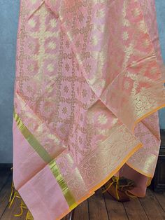 Stunning Banarasi Dupatta in Pastel Pink or Baby Pink Color with Muted Zari Weaving. Floral Design in Jaal with tassles. Give your Outfit a new look with these beauties. ❤️ Please note dupatta has yellow color tassels at the ends. Item: DupattaBase color : Pastel Baby Pink Fabric : Soft Semi Silk (Not Pure Silk)Work : Zari Weaved with tasselsLength of the Dupatta : 92 inches approx.Width of the dupatta : 35 inches (Approx.) Store Policies- No return or exchange will be accepted for color variations.- No return or exchange will be accepted if the color does not match your other clothing or your partners or anyone else.- Since this Dupatta is handmade hence little inconsistencies may be there however it is not considered as a defect.- Zari or thread coming out or on folds is not considered a Traditional Silk Thread Wear For Celebration, Traditional Wedding Wear With Woven Motifs, Chanderi Pink Self Design Dupatta, Pink Chanderi Dupatta With Self Design, Chanderi Pink Dupatta With Self Design, Handloom Traditional Wear For Diwali Celebration, Silk Thread Traditional Wear For Diwali Puja, Silk Thread Traditional Wear For Festivals And Celebrations, Pink Self Design Dupatta For Celebration