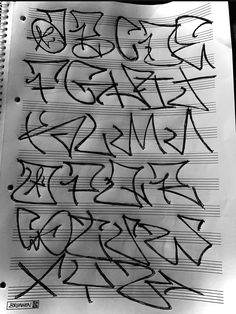 some graffiti writing on top of a sheet of paper