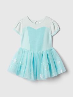 Soft cotton and tulle princess dress.  Round neck with keyhole closure at back.  Short cap sleeves.  Layered tulle skirt.  Allover Disney Princess Elsa graphics.  Fit and flare silhouette.  Hits at the knee. Disney Baby Princess, London Halloween, Baby Tulle Dress, White Tulle Dress, Disney Princess Babies, Baby Snow, Disney Princess Elsa, Ice Dresses, Elsa Dress