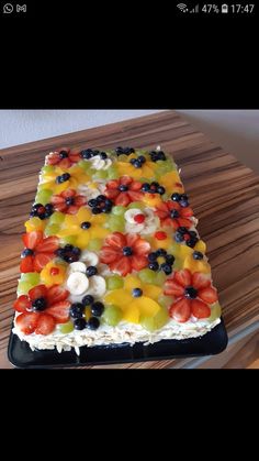 a cake that has been decorated with fruit