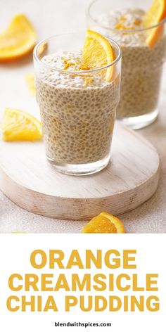 orange creamsice chia pudding in two glasses on a cutting board