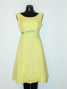 Vintage 1950s Type: Dress Brand: Unbranded Material: no tag- Chiffon & Rayon Size: Small Description: This is a Gorgeous Canary Yellow sleeveless dress with rounded neckline. This dress has a See thru chiffon material over Rayon material. This dress has a back zipper closure and has a soft Velvet leaf like designs around the waist. The inside skirt of the dress has a stiffened fabric which gives the dress shape. This dress is absolutely beautiful and very 50s ! Condition: Great Condition- no hol Yellow Chiffon Dress, Yellow Outfit, Canary Yellow, 60s Dress, Chiffon Material, Rounded Neckline, Dress Shapes, Dress Suits, Soft Velvet