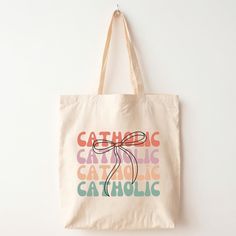 a tote bag that says catholic catholic catholic catholic on the front and back