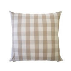 a beige and white checkered pillow on a white background