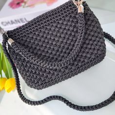 👜GENERAL FEATURES👜  FeyZolfey black crochet bag is produced from 100% polypropylene yarn. The overall dimensions of this women's shoulder bag are 20x18x8cm. The lining inside this black handbag is satin material and has one inner pocket. This quilted bag also offers sophisticated styling. This top handle purse has one knitted (85cm) shoulder strap and one crocheted short handle to allow you to wear it as a classic handbag. It also has a zipper closure system. These handmade luxury bags do not contain chemicals that may affect human health. ⭐A UNIQUE PIECE⭐  FeyZolfey knitted bag for ladies has a magnificent look thanks to its unique design. Summer bags for women, which have multiple uses, can be used daily, on the beach, at an invitation, or in areas such as school. Due to the perfect si Black Crochet Bag, Yarn Gifts, Purse Handmade, Colorful Backpacks, Quilted Tote Bags, Black Handbag, Classic Handbags, Quilted Totes, Summer Bag