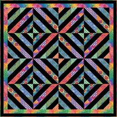 a black and colorful quilt with an abstract design