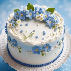 a white cake with blue and yellow flowers on it