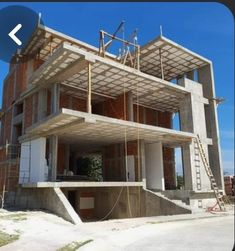 a building under construction with scaffolding on the roof