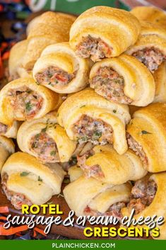 a pile of sausage and cream cheese crescents on a platter with text overlay