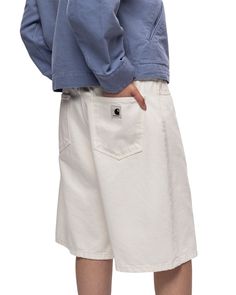 The Women's Brandon Short is cut in a loose straight fit with a low waist from Smith denim, which is a heavyweight cotton fabric. The five-pocket style comes in several iterations ranging from a stone-washed version, offering a subtly worn-in finish, to a stone-bleached version, which is lighter in appearance. A back yoke and a woven Square Label complete the design. Smith denim: 100% cotton Loose fit, low waist Back yoke Zip fly Square Label average inseam: 10" I031919 WHIT Relaxed Fit White Rigid Denim Bottoms, White Rigid Denim Jeans With Pockets, White Washed Bottoms For Streetwear, White Jeans With Patch Pockets For Streetwear, Casual White Rigid Denim Bottoms, White Cotton Jeans With Hip Pockets, Carhartt Wip, Low Waist, White Shorts