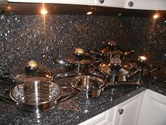 pots and pans are sitting on the kitchen counter