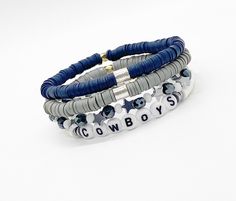 "Represent your team with these adorable Gameday bracelets! Stack of 4 Bracelets are stretch and made to fit 7-7.5\" wrist comfortably but can be made smaller or larger upon request. We can also make with gold accents, put special requests in comments box when ordering!" Cheap White Beaded Bracelets For Game Day, Football Team Clay Bead Bracelets, Phillies Clay Bead Bracelet, Adjustable Sporty Beaded Bracelets For Game Day, Personalized Blue Bracelets For Game Day, Game Day Bracelet Stacks, Dallas Cowboys Bracelets, Dallas Cowboys Beaded Bracelet, Dallas Cowboy Bracelet