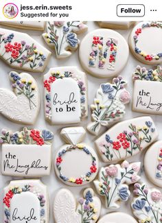 cookies decorated with flowers and sayings are on display for the guests to take home