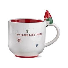 a white coffee mug with a red and green handle that says no place like gnome