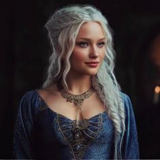 a woman with long white hair and blue eyes wearing a dress in the game of thrones