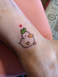 a person with a small tattoo on their foot