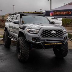 a gray toyota truck parked in a parking lot