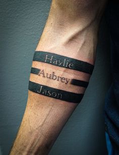 a man's arm with his name tattooed on it