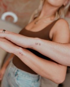 tiny roman numeral couple tattoo Matching Tattoos With Significant Other, Elopement Tattoo Ideas, Mark 10:9 Tattoo Couple, Small Tattoos For Husband, Partner Matching Tattoos, Tattoos To Get For Your Husband, Tiny Tattoos Couples, Husband Wife Matching Tattoos, One Life One Love Tattoo