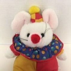 a stuffed mouse with a clown hat on it's head and polka dots around its neck