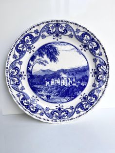 a blue and white plate sitting on top of a table