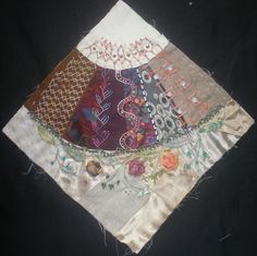 a close up of a patchwork piece of cloth