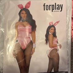 a woman in a bunny costume is standing next to a sign that says, forplay