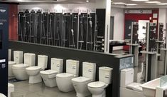 a row of white toilets sitting next to each other